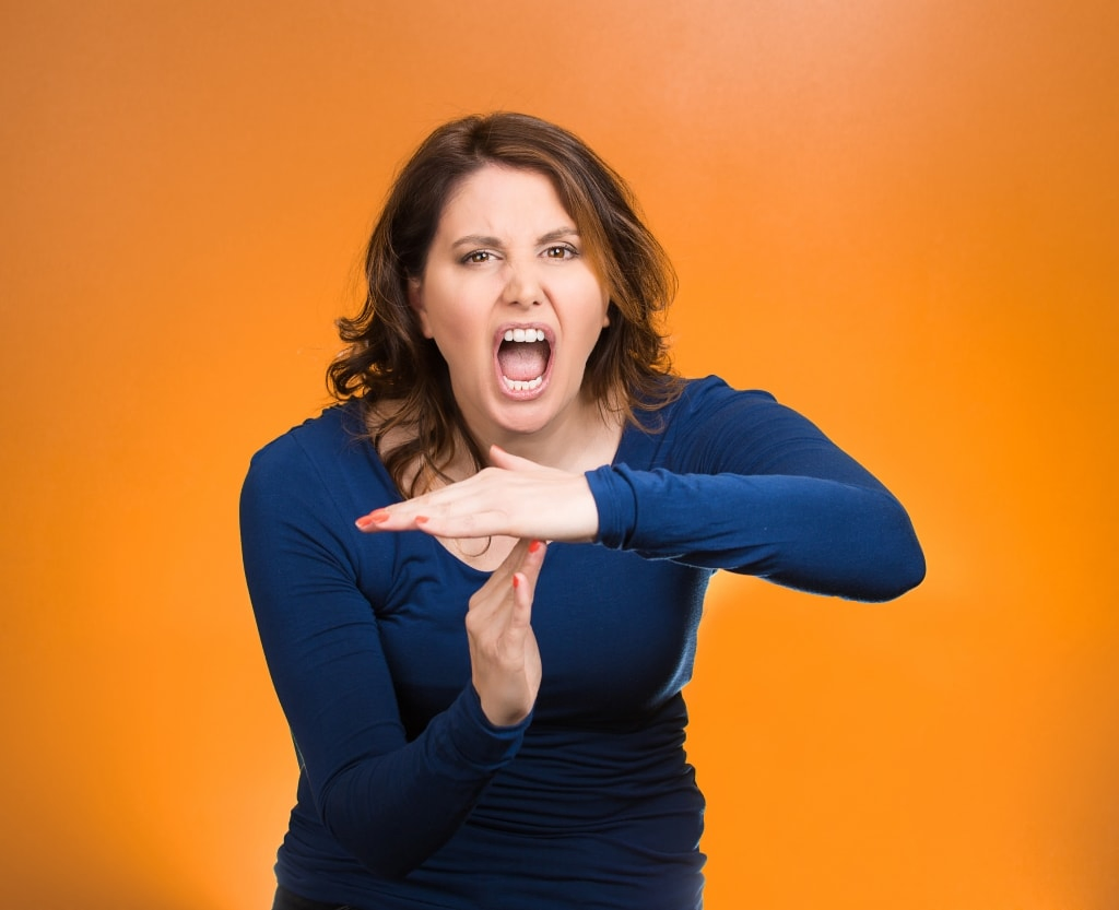 Screaming woman, showing timeout gesture with hands